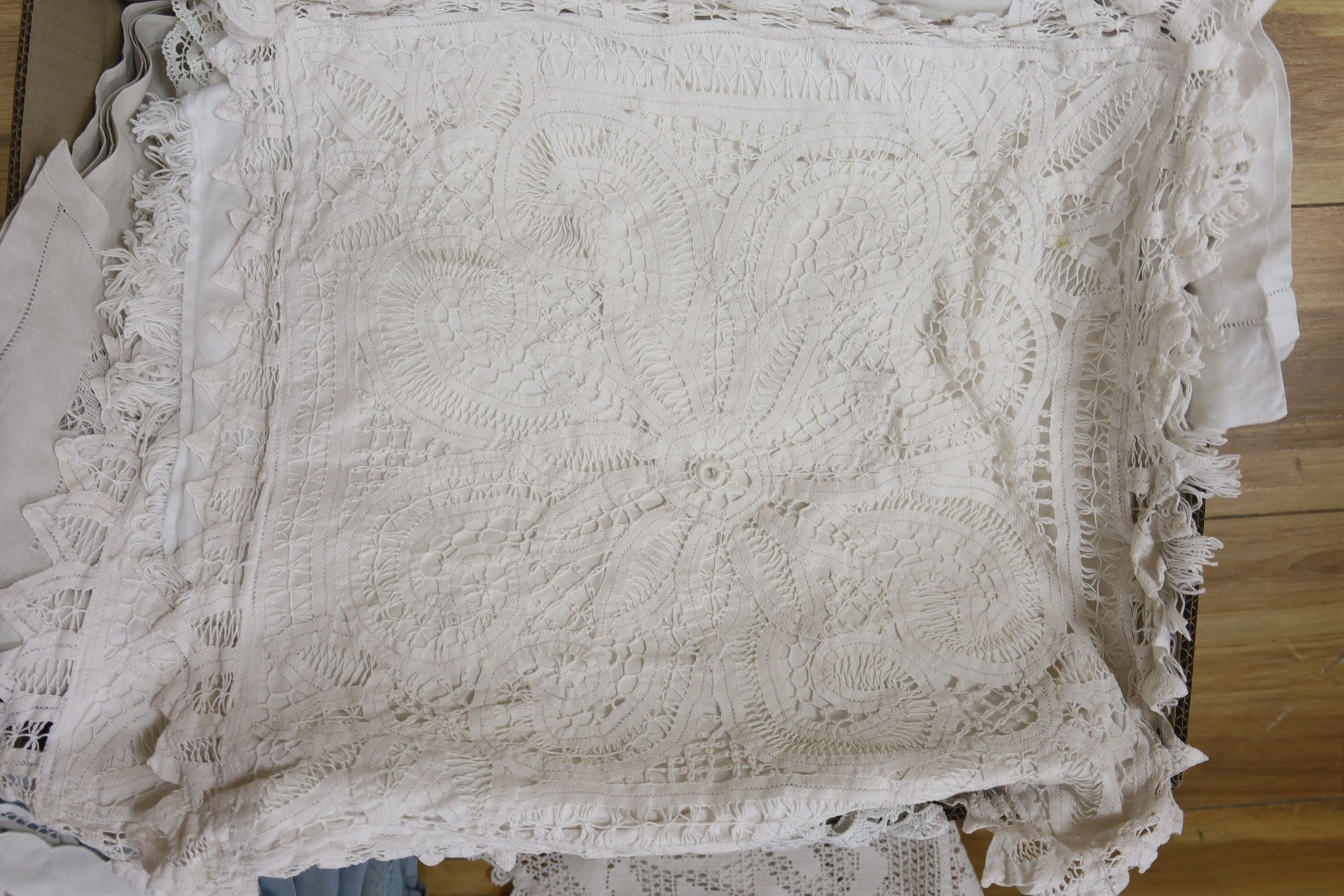 A large collection of table linen including drawn thread work, tape lace, cutwork and crochet cloths, mats. etc